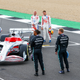 The 2021 F1 drivers gather round a model of the 2022 F1 car